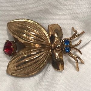 Antique gold bug brooch with blue/red glass gems